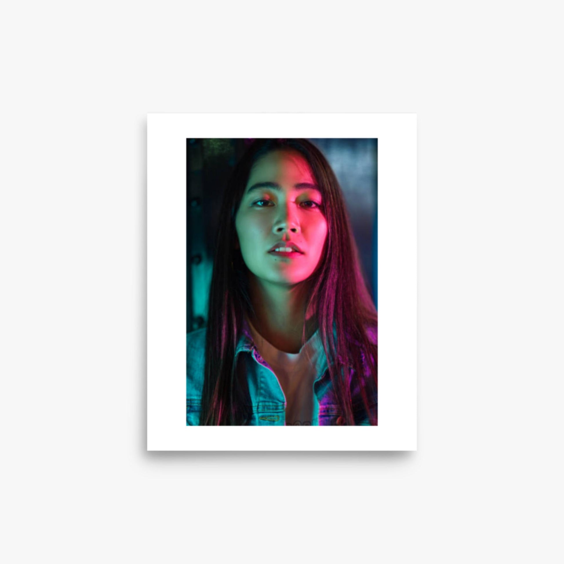 Portrait of young woman lit by colorful neon lights at night 8x10 in Poster