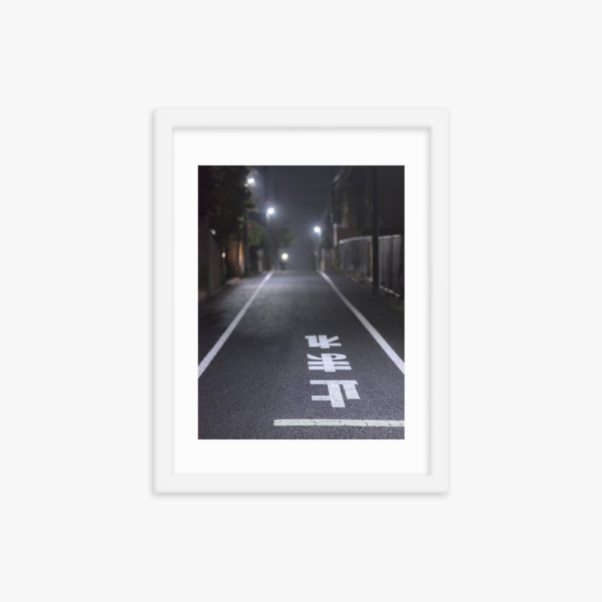 Typical road by night with the stop sign in Japanese written on the ground 12x16 in Poster With White Frame