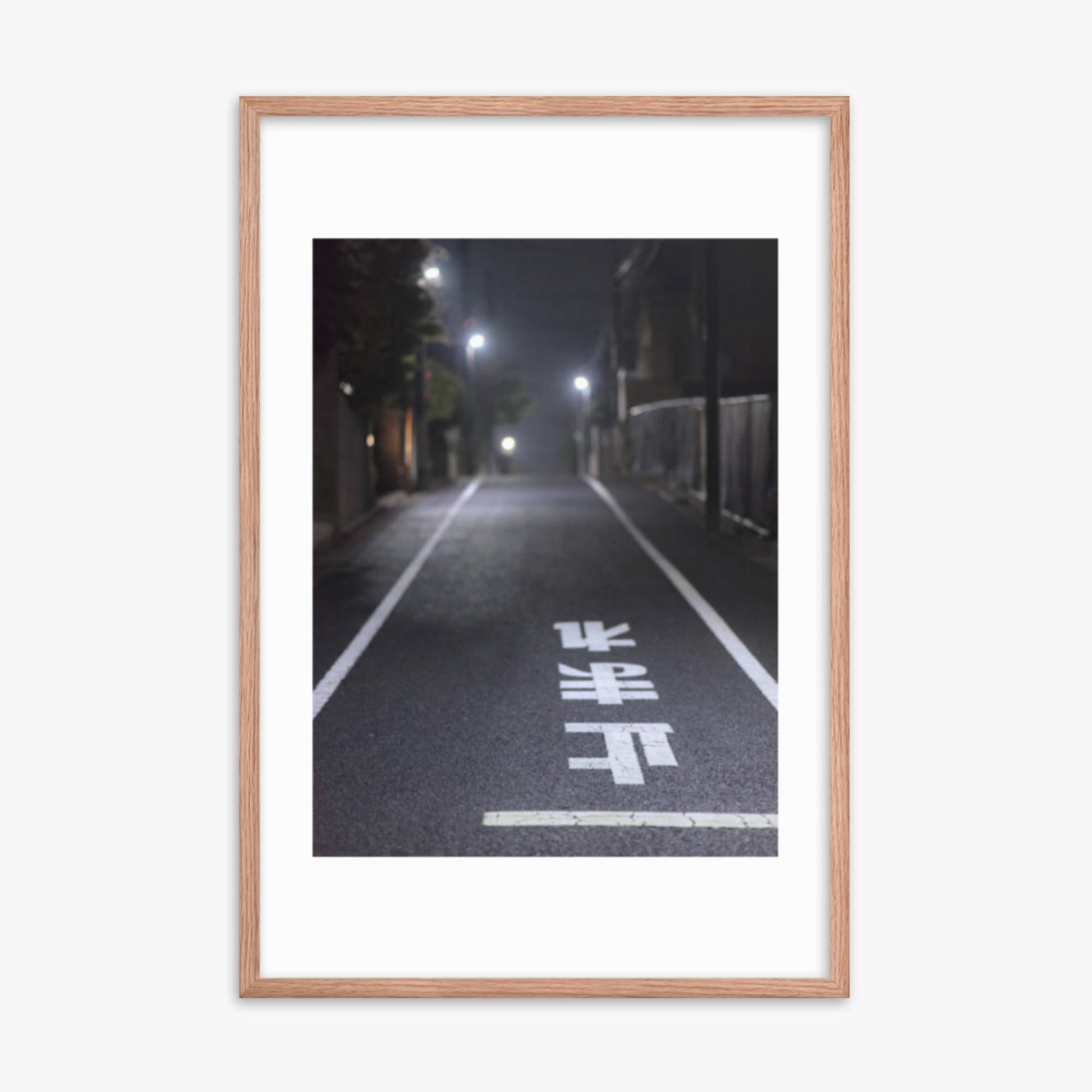 Typical road by night with the stop sign in Japanese written on the ground 24x36 in Poster With Oak Frame